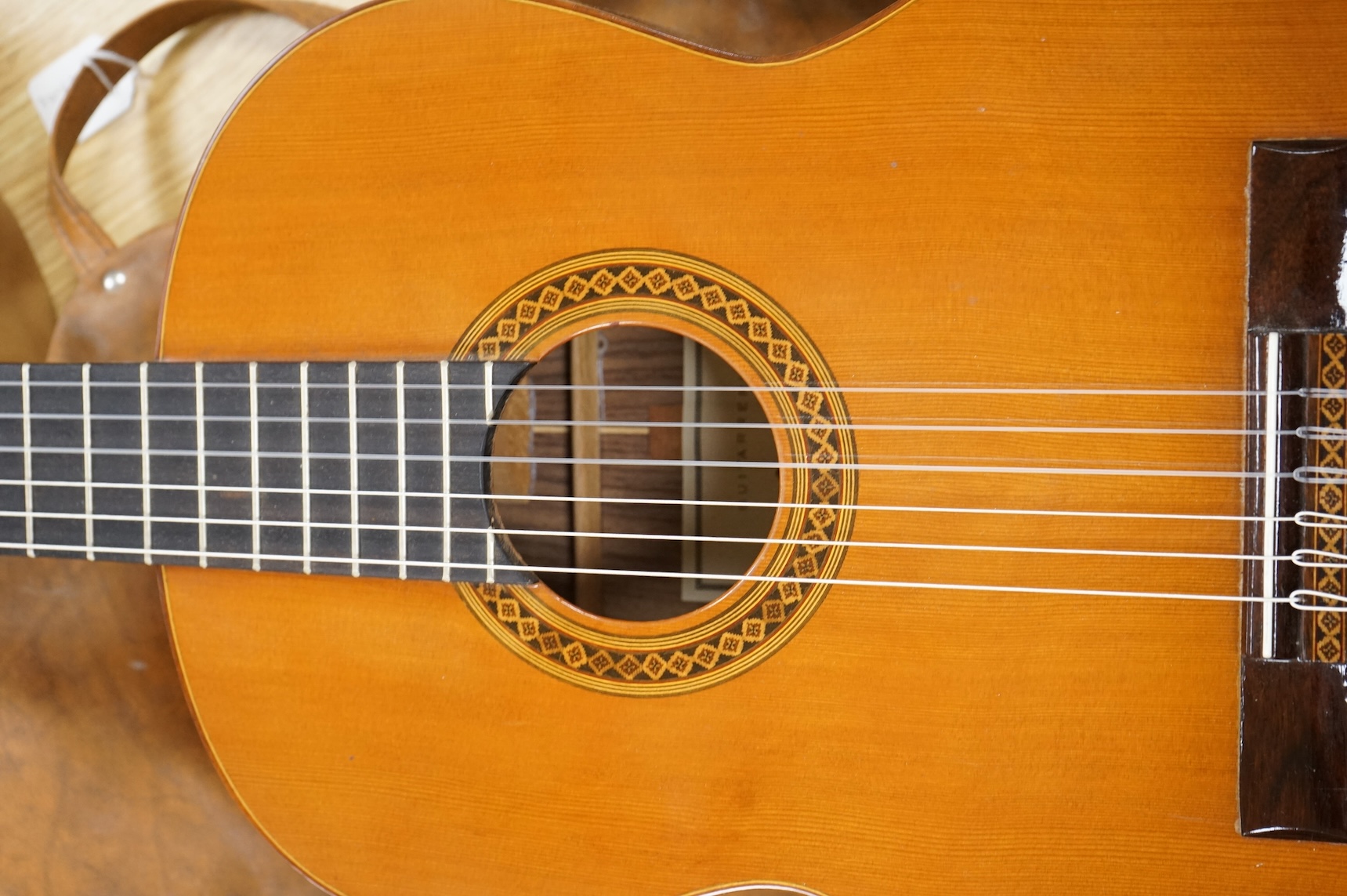 A Spanish Manuel Contreras classical guitar, with cedar front, Indian rosewood back sides and ebony fingerboard, with makers label inside body; M.G. Contreras, Madrid, back 49cm